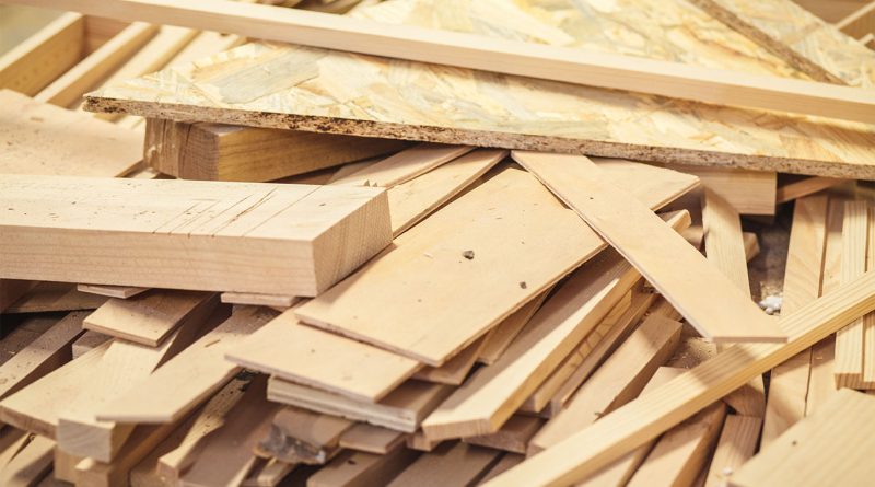 Timber wood waste piled up to support Burying wood waste article