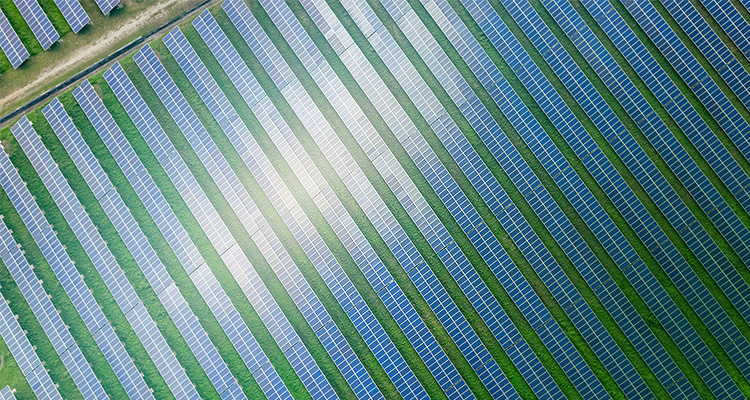 Aerial view of solar farm. Solar power for green energy. Sustainable resources. Solar cell panels use sun light as a source to generate electricity. Photovoltaics or PV. Sustainable renewable energy.
