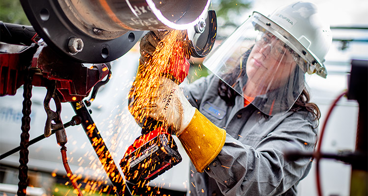 Woman working on machinery for ENFRA article