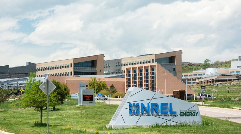U.S. Secretary of Energy Chris Wright visits the newly renamed National Laboratory of the Rockies, with solar panels and wind turbine in the background