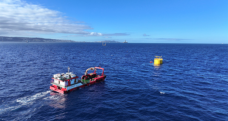 a red marine research vessel at sea